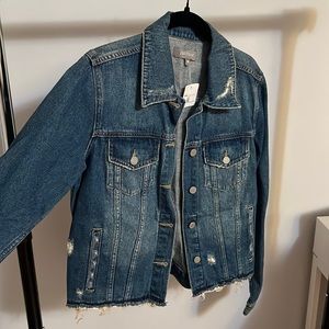 Blue ripped jean jacket